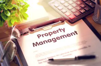 Business Concept - Property Management on Clipboard.