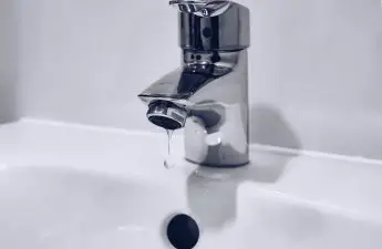leaking bathroom faucet at rental property